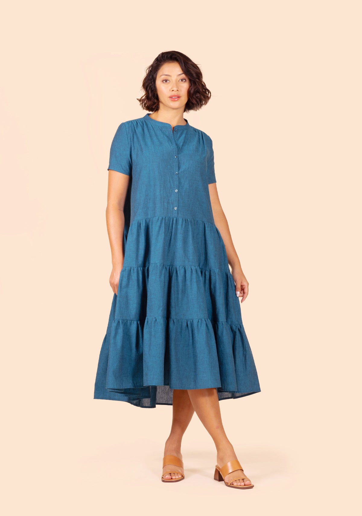 Front view of the Poppy Dress View C in teal fabric with short sleeves and ankle-length tiered skirt.