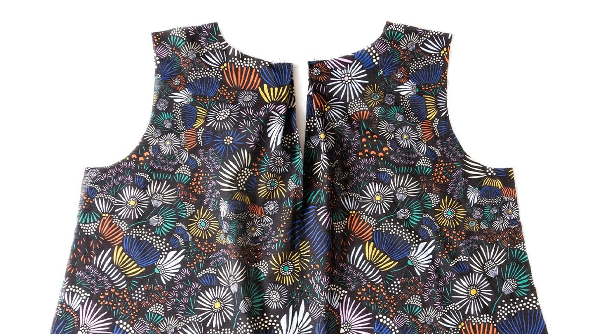 Hadley back bodice in colorful geometric print showing completed center back seam and keyhole opening with secured pleat detail