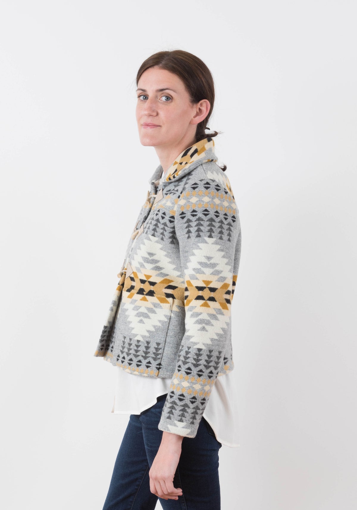 Side view of short Cascade Duffle Coat in grey and gold Pendleton wool with triangle toggle tabs and collar.