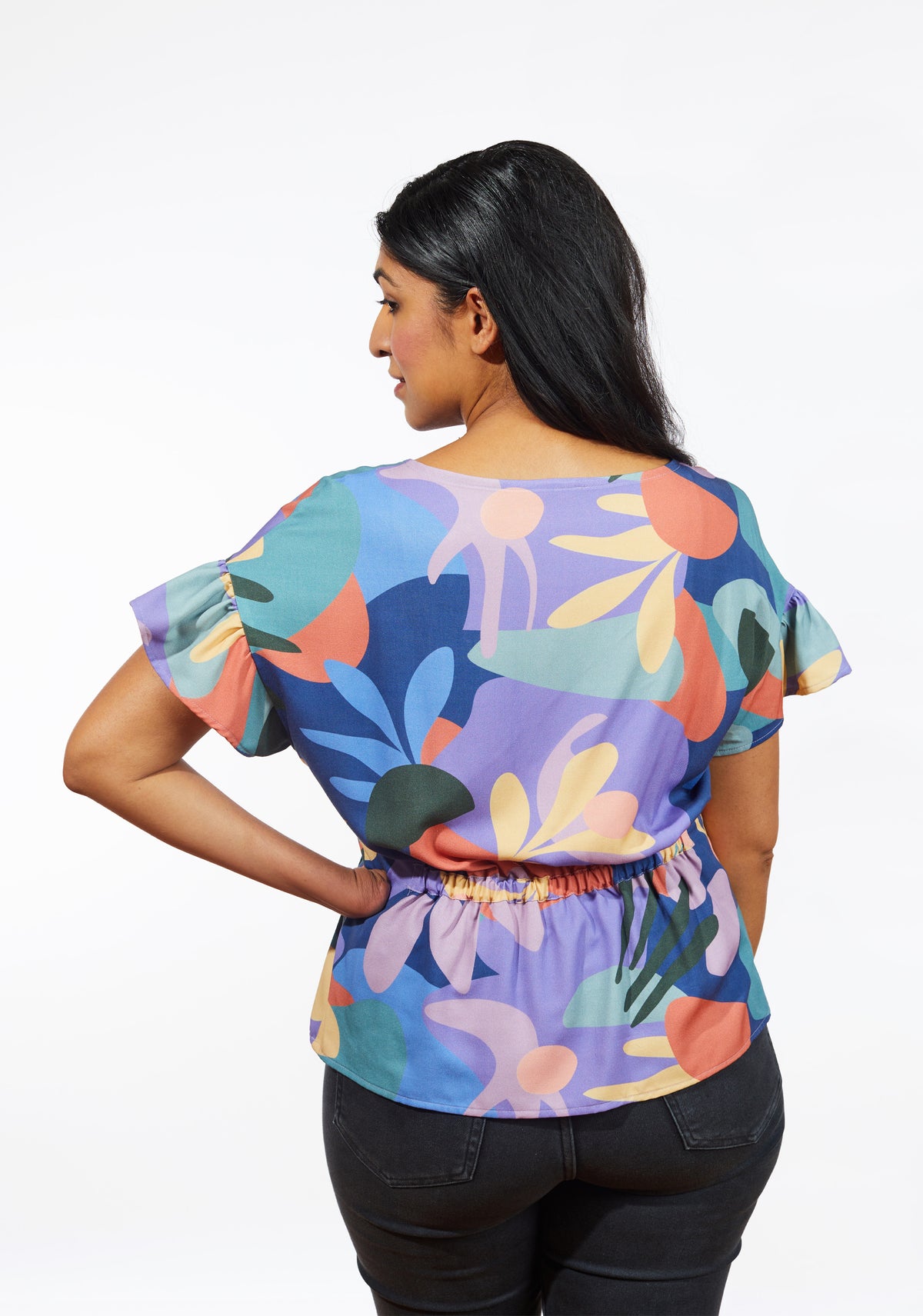 Back view of Corin Top showing elastic waist casing and short flutter sleeves.