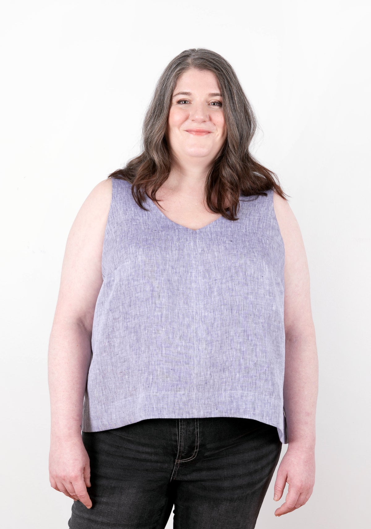 Model: Size 20, 5'5" | Model in sleeveless lilac Hadley Top, front view. Features V neckline and subtle A-line shape.