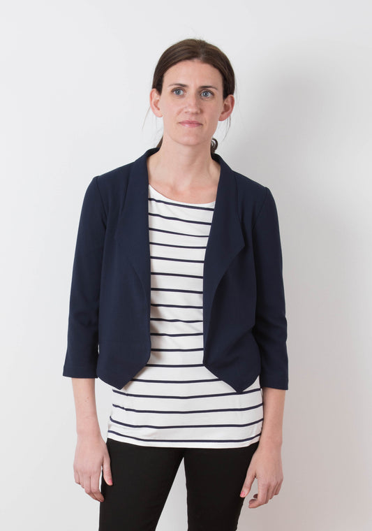 Model: Size 6, 5'8" | Model wearing Morris Blazer in navy stretch woven fabric, front view with striped tee and black pants.