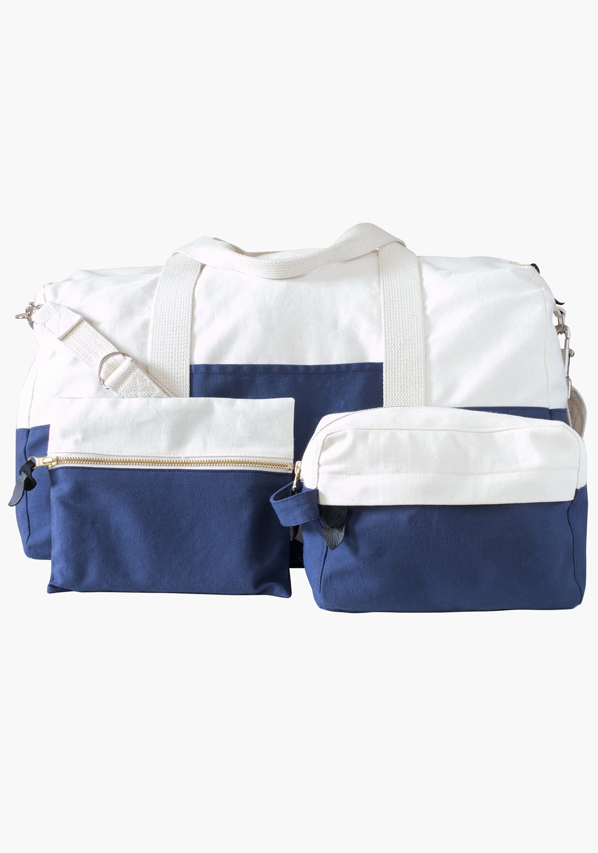 Portside Travel Set shown with dopp kit and zip pouch attached to duffle bag, all in blue and natural canvas.