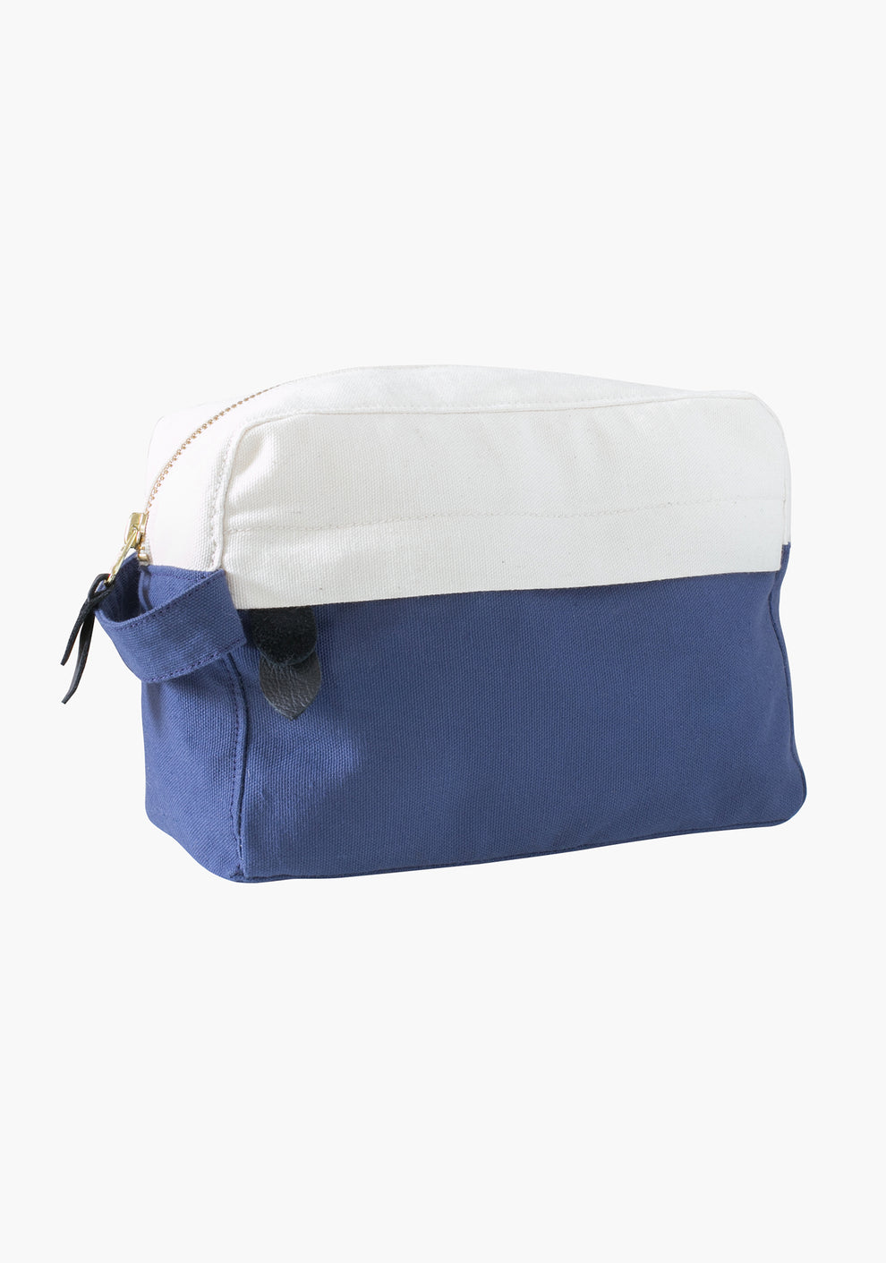 Side view of Portside dopp kit in blue and natural canvas with gold zipper.