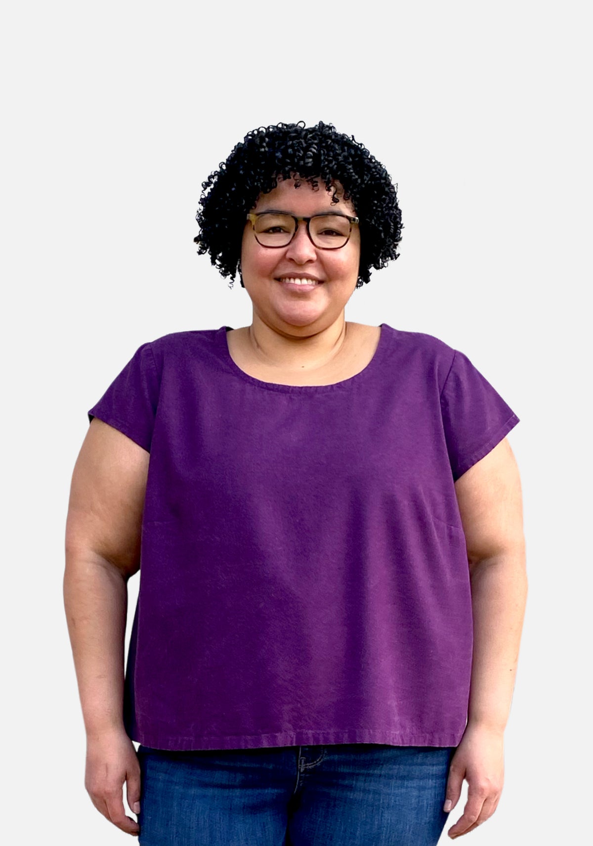Model: Size 24, 5'5" | Model wearing a short-sleeved purple Scout Tee with a scoop neckline and relaxed fit, shown from the front.