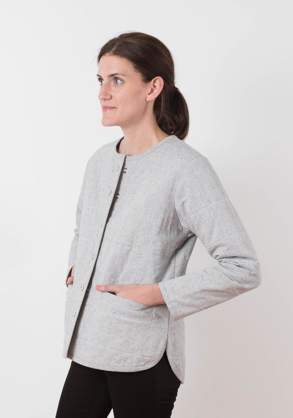 Side view of gray quilted Tamarack Jacket in View B showing curved hem and relaxed fit.