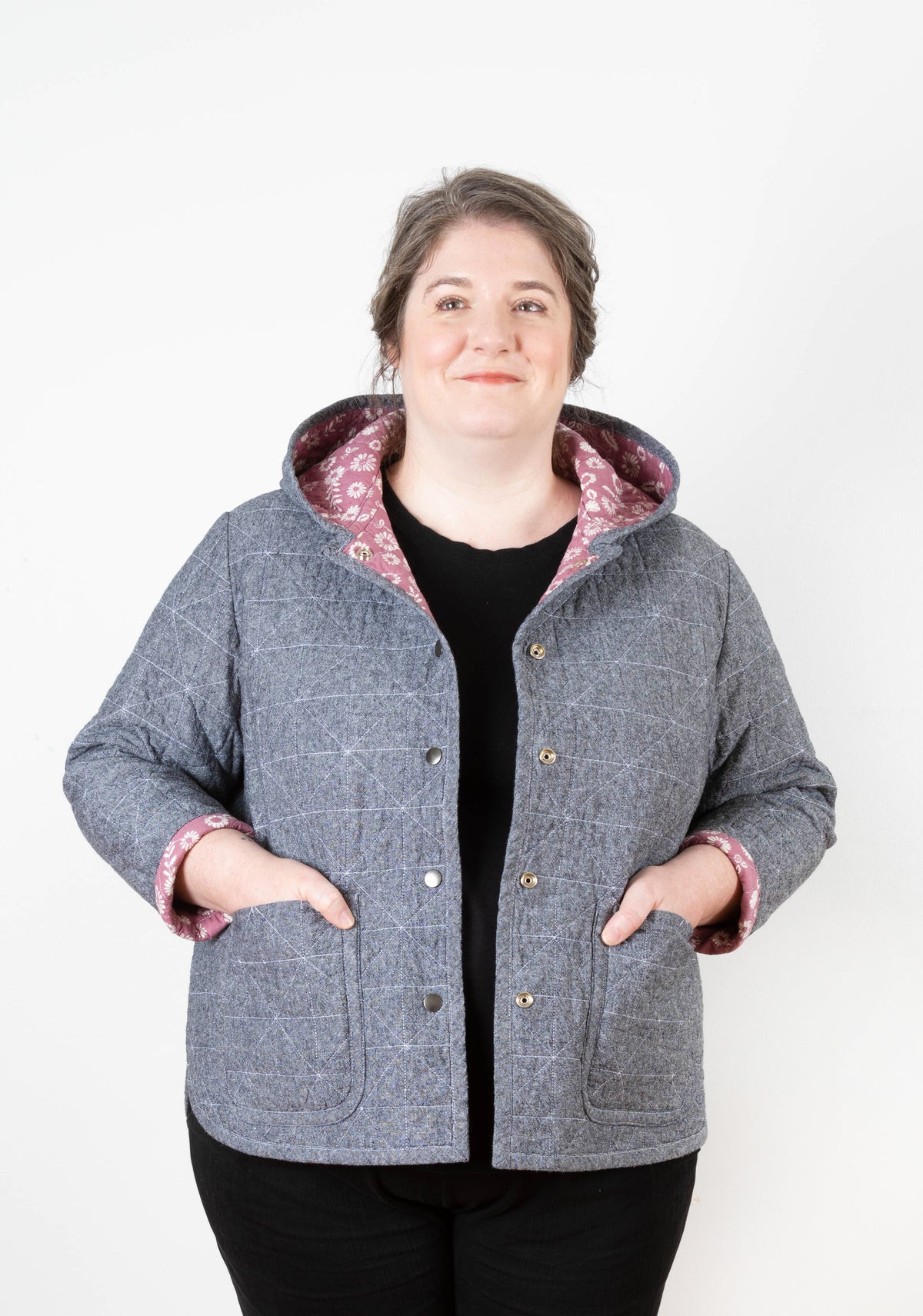Model: Size 20, 5'5" | Front view of model wearing Tamarack Jacket in orange stripes with collar add-on, hands in pockets.