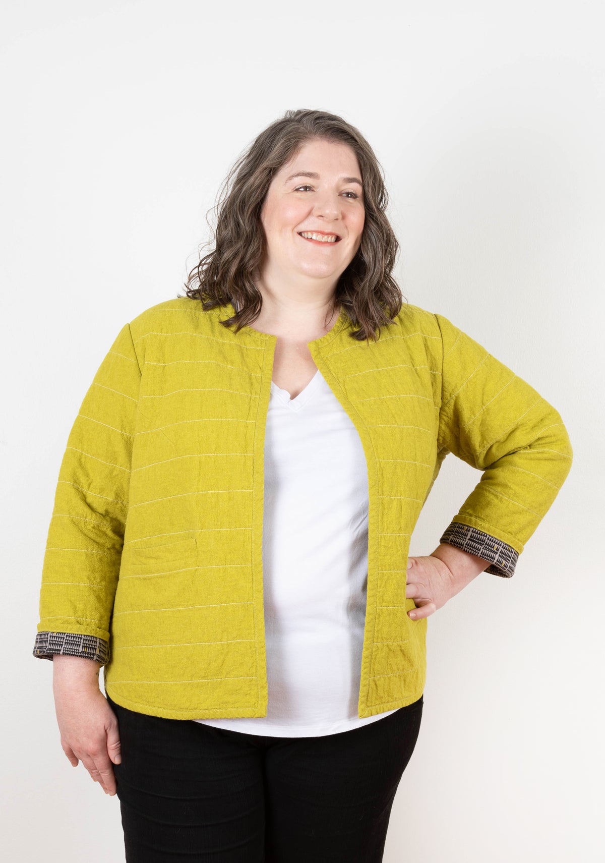 Model: Size 20, 5'5" | Front view of model wearing Tamarack Jacket with hand on hip, showing front opening and sleeve cuff detail.