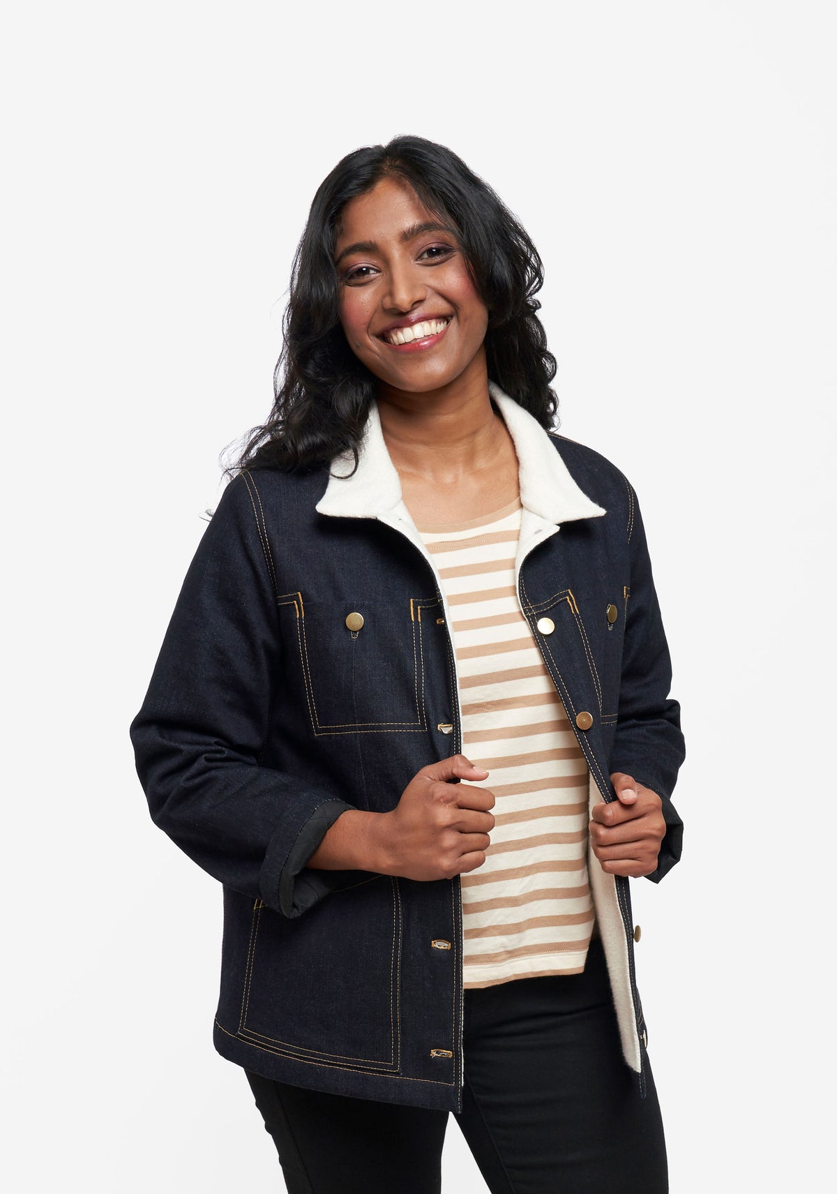Model wearing Thayer Jacket unbuttoned to show striped shirt underneath.