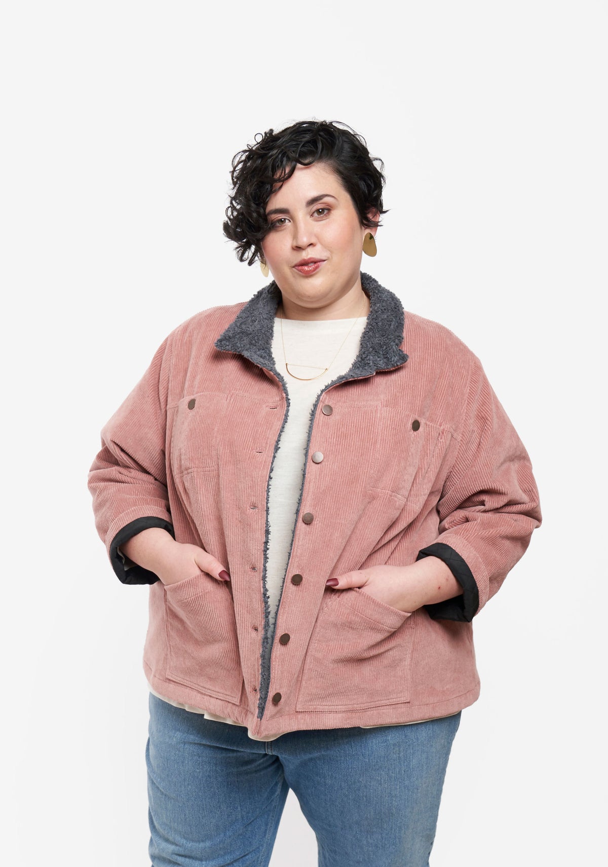 Model wearing Thayer Jacket with hands in pockets, showing relaxed fit and button front.
