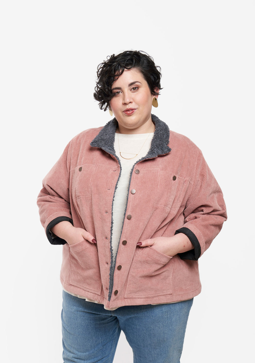 Model wearing Thayer Jacket with hands in pockets, showing relaxed fit and button front.