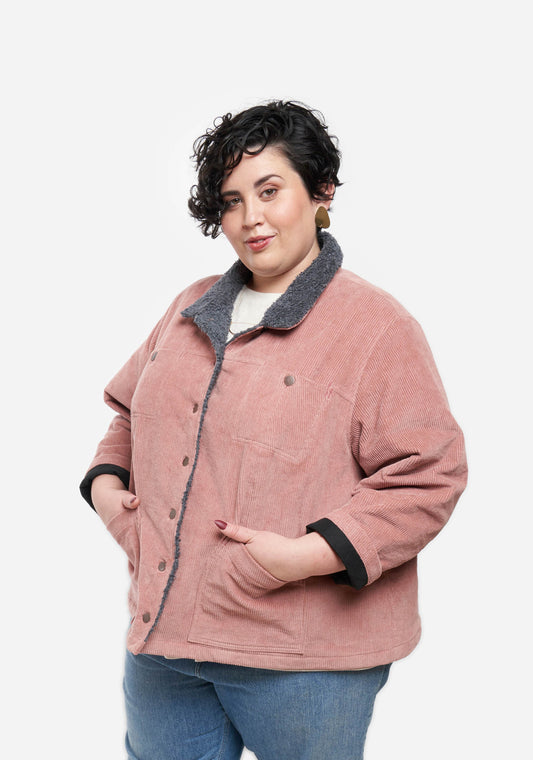 Model: Size 28, 5'7" | Front view of model wearing pink corduroy Thayer Jacket with contrasting collar and topstitching.