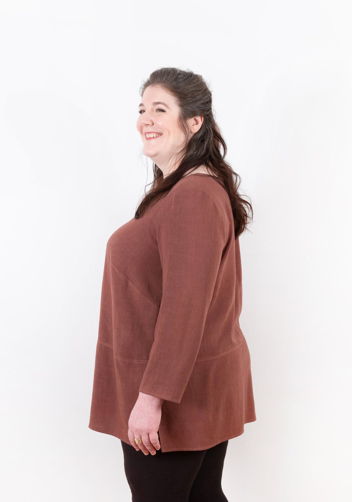 Side view of mauve Uniform Tunic showing A-line shape and 3/4 sleeve length.