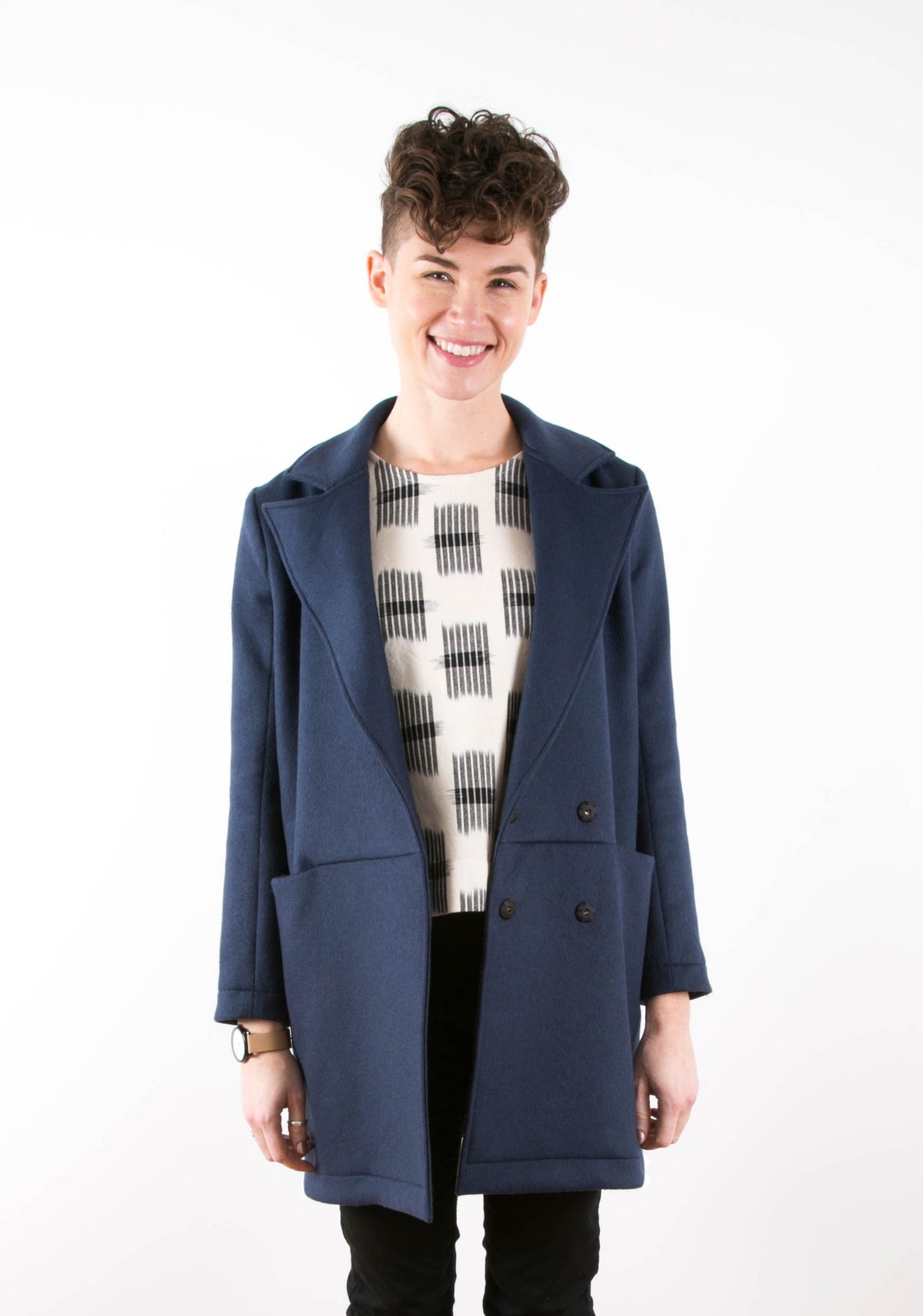 Model: Size 6, 5'7" | Front view of model wearing navy blue Yates Coat with large lapels and patch pockets.